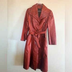 Vintage Leather Trench Coat, Likely Dating From the 1970s. 
Burnt red color.